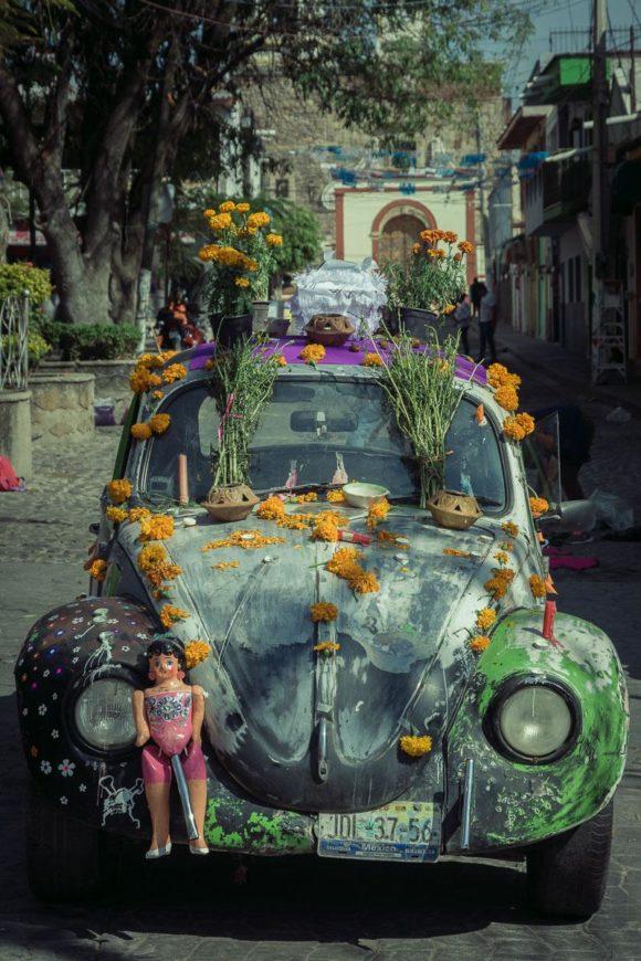 A muñeca de cartón on a Volkswagen Beetle that has been converted into a Day of the Dead altar in Ajijic, Jalisco, Mexico.