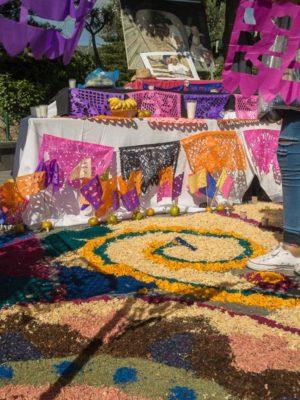 People construct an altar with a tapete in the plaza of Ajijic, Jalisco, Mexico.