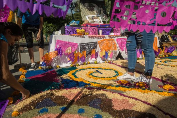 People construct an altar with a tapete in the plaza of Ajijic, Jalisco, Mexico.
