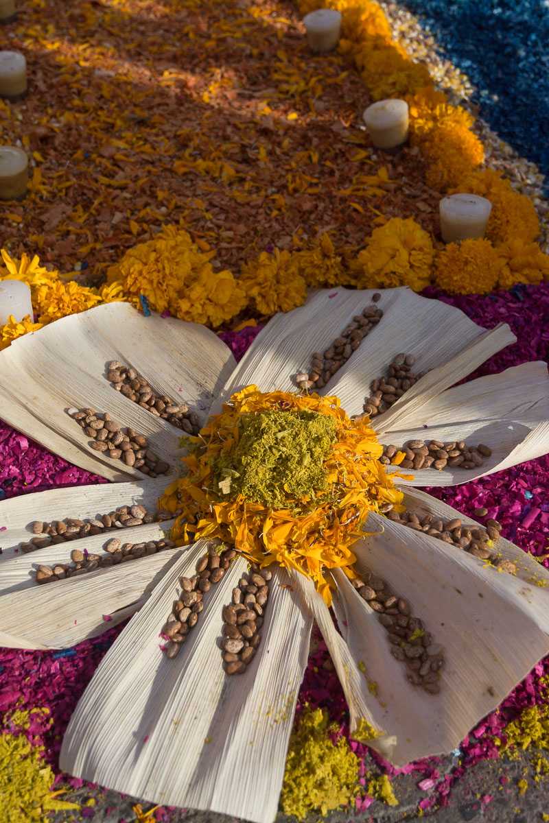 Beans, corn husks and a marigold flower create a design at an altar in Chapala, Jalisco, Mexico.