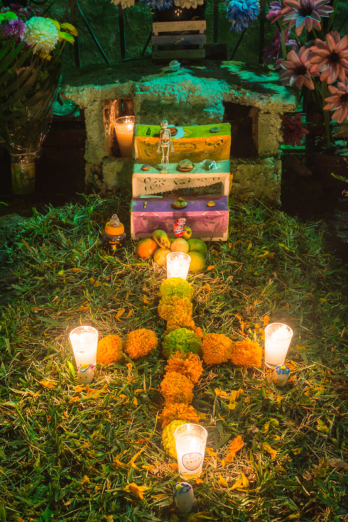 A candlelit ofrenda on the Noche de los Angelitos in the graveyard in Ajijic, Jalisco, Mexico.