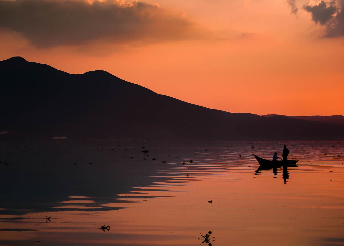 Boat and reflection on Lake Chapala, Mexico