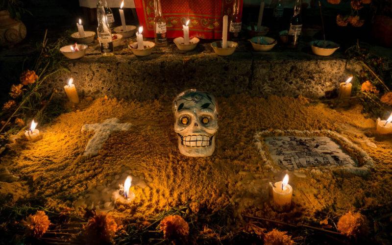 Emptied Corona bottles line the rear of an altar on Noche de Muertos 2015 in Chapala, Jalisco, Mexico.