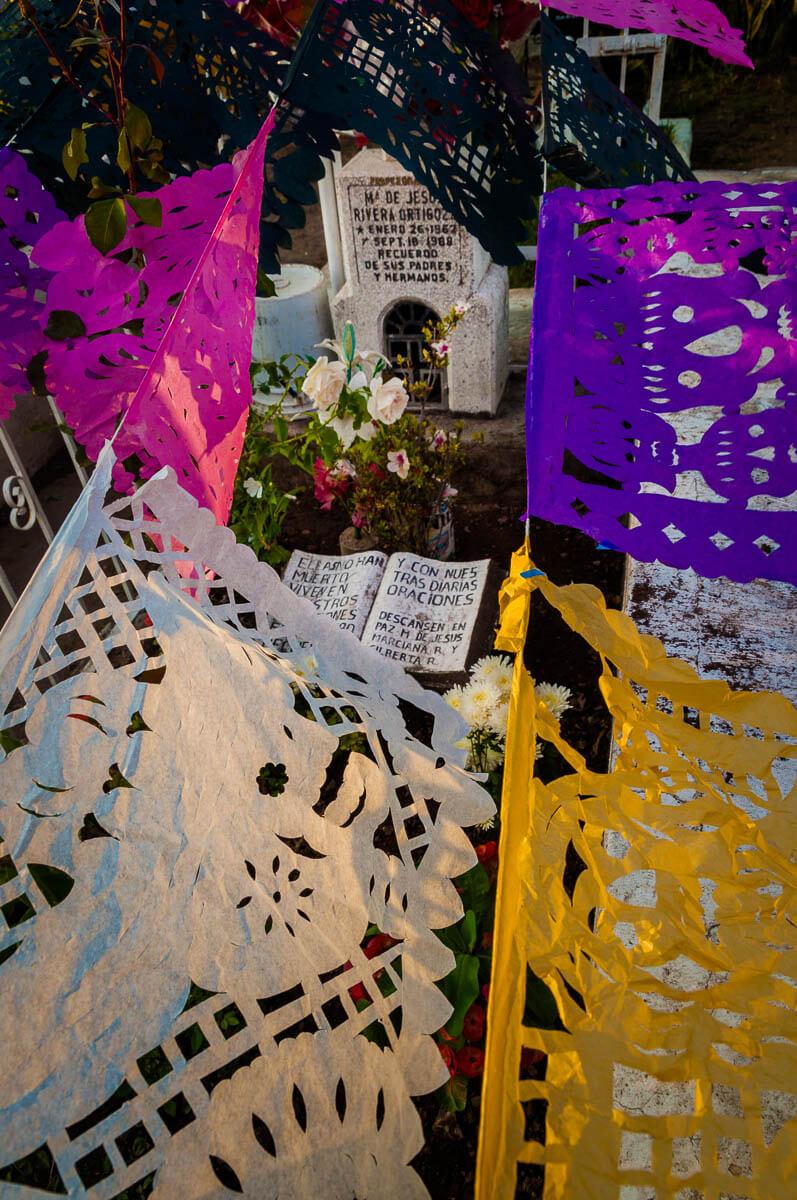 Papel picado hangs over a grave on November 1, 2010, in the Ajijic cemetery.