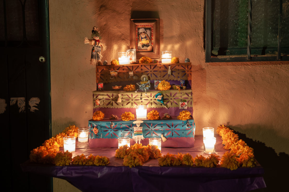 An altar on the Day of the Dead 2010. Included are mini representations of the boy's favorite foods: Domino's pizza, Cheetos, suckers, tamales, sandwiches, hamburgers.