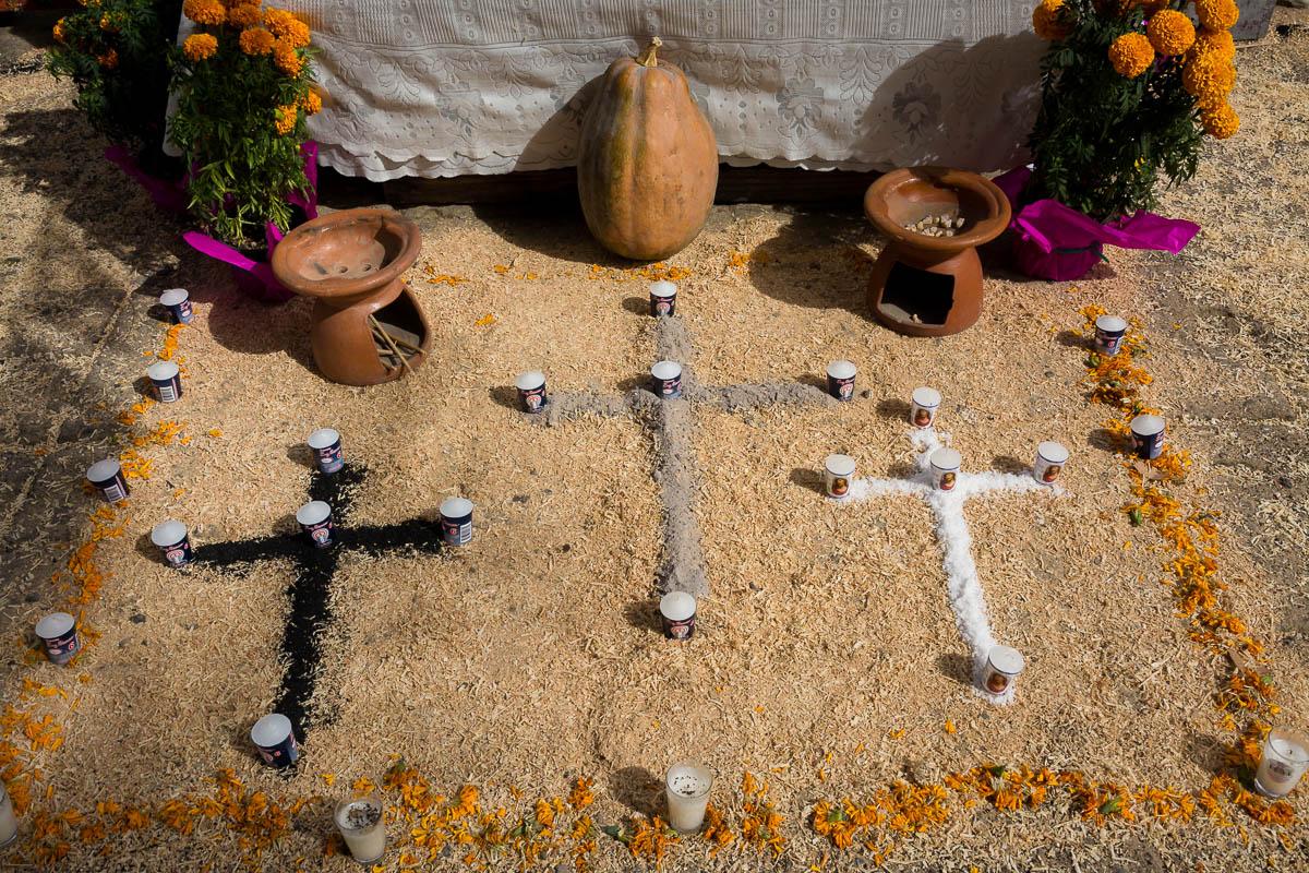 Charcoal, ash, and salt were used to make these crosses at the entrance of a Day of the Dead ofrenda in Chapala, Jalisco, Mexico.