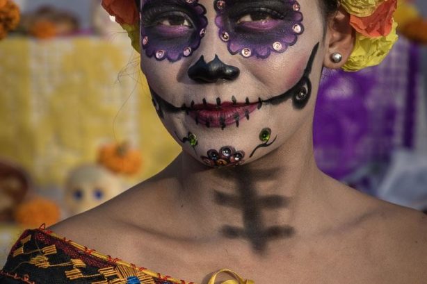 Woman posing as a catrina in Chapala on the Day of the Dead