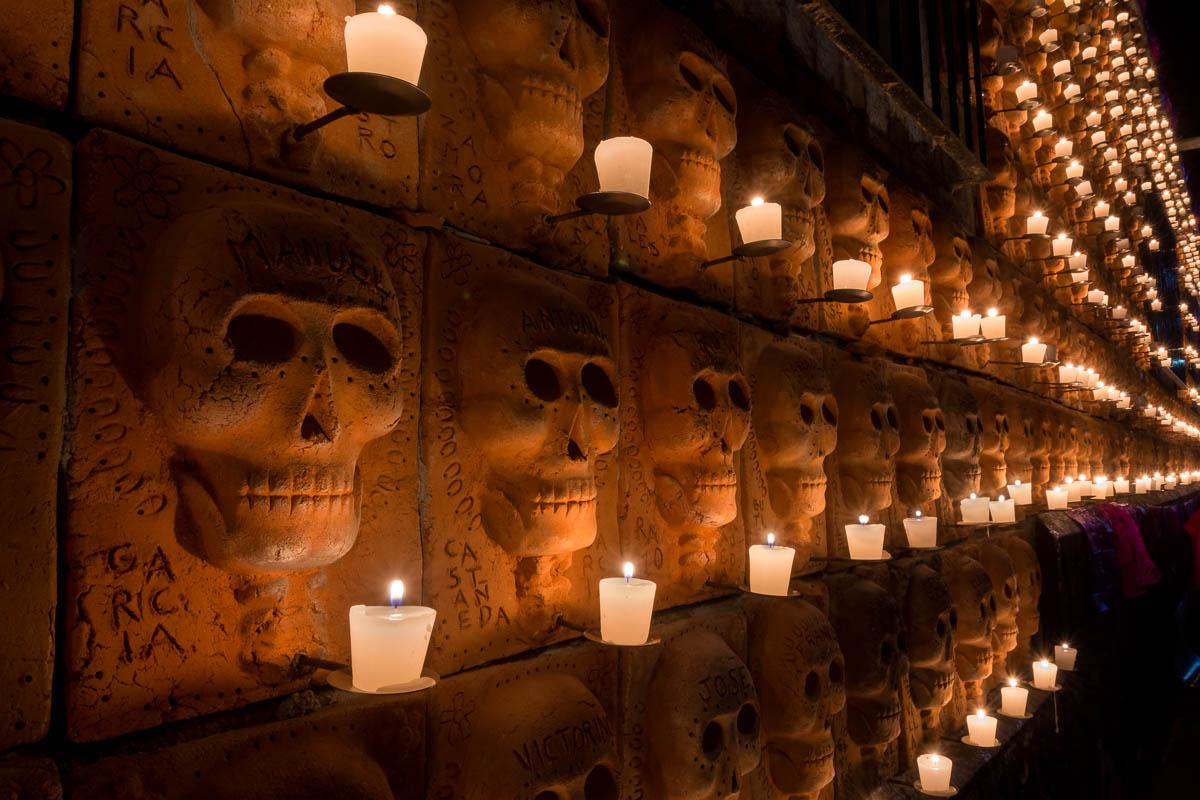 600 terracotta skulls are lit up by candles, each representing a deceased town or family member.