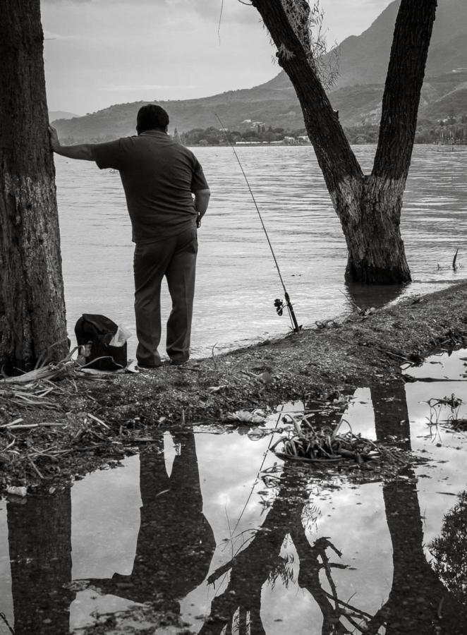 A man waits for a fish to bite at Lake Chapala.