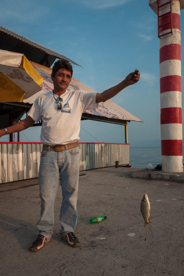 Man using soda bottle to fish at Lake Chapala