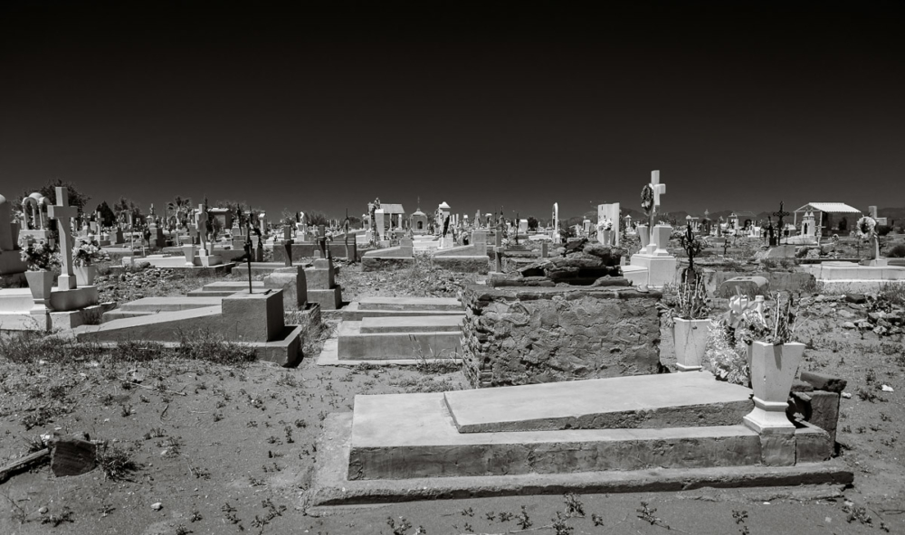 A graveyard by the freeway passing through Estación Llano, Sonora, Mexico.
