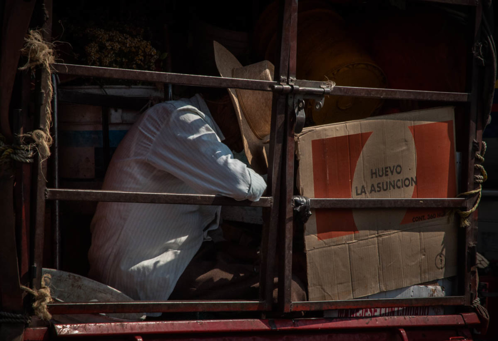A man rides in the back of a truck in Guadalajara, Jalisco, Mexico.
