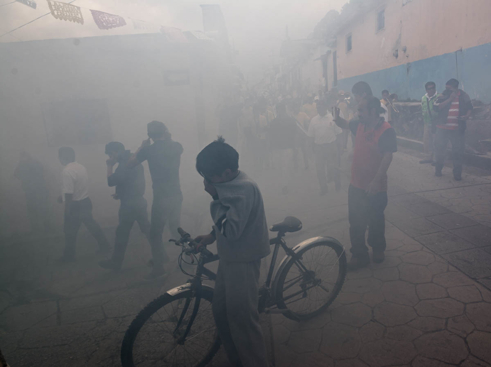 Bombas exploding during a procession for la Virgin de la Merced in San Cristóbal de las Casas, Chiapas, Mexico