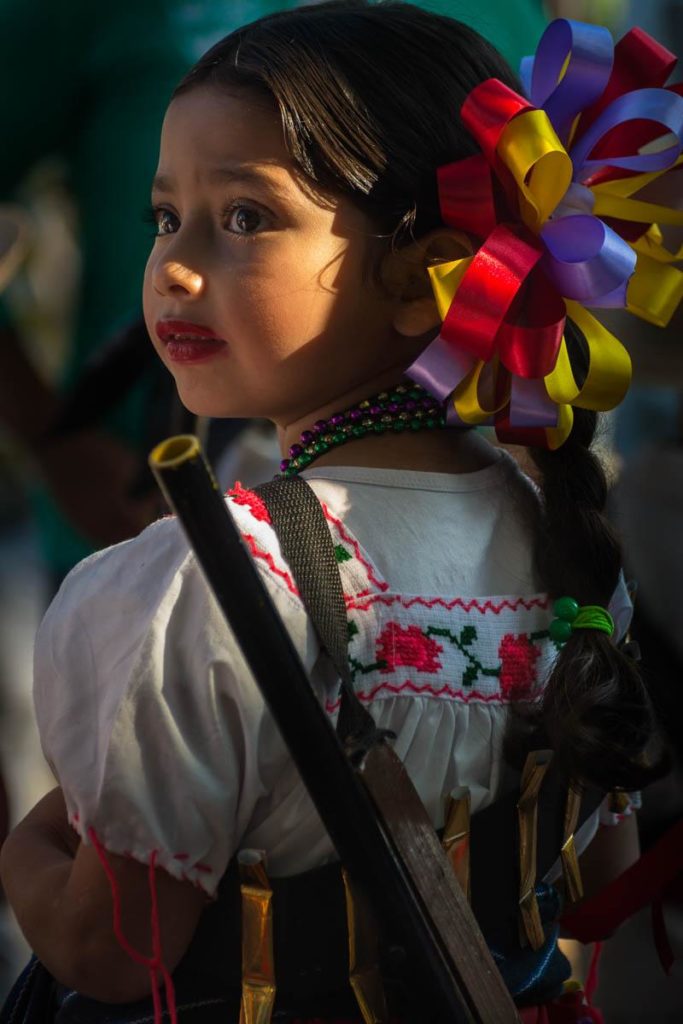 A soldadera, also known as adelita, takes part in the Revolution Day parade in San Antonio Tlayacapan, Jalisco, Mexico.