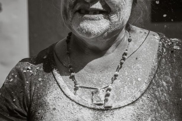 A woman during pre-Carnaval celebrations covered in flour in Ajijic.