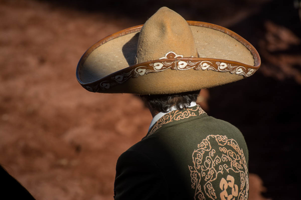A cowboy's sombrero and traditional charro dress.