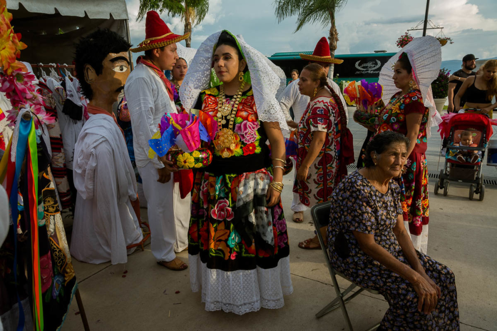 Dancers prepare for another dance during a performance of the guelaguetza in Chapala, Jalisco.