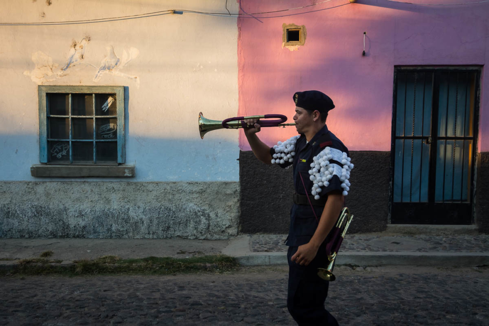 A bugle player during a parade in Mexico.