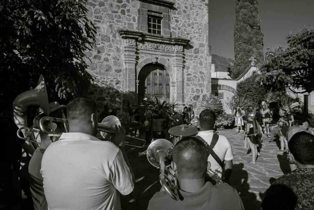 Banda and Aztec dancers during a procession for San Sebastián in Ajijic.
