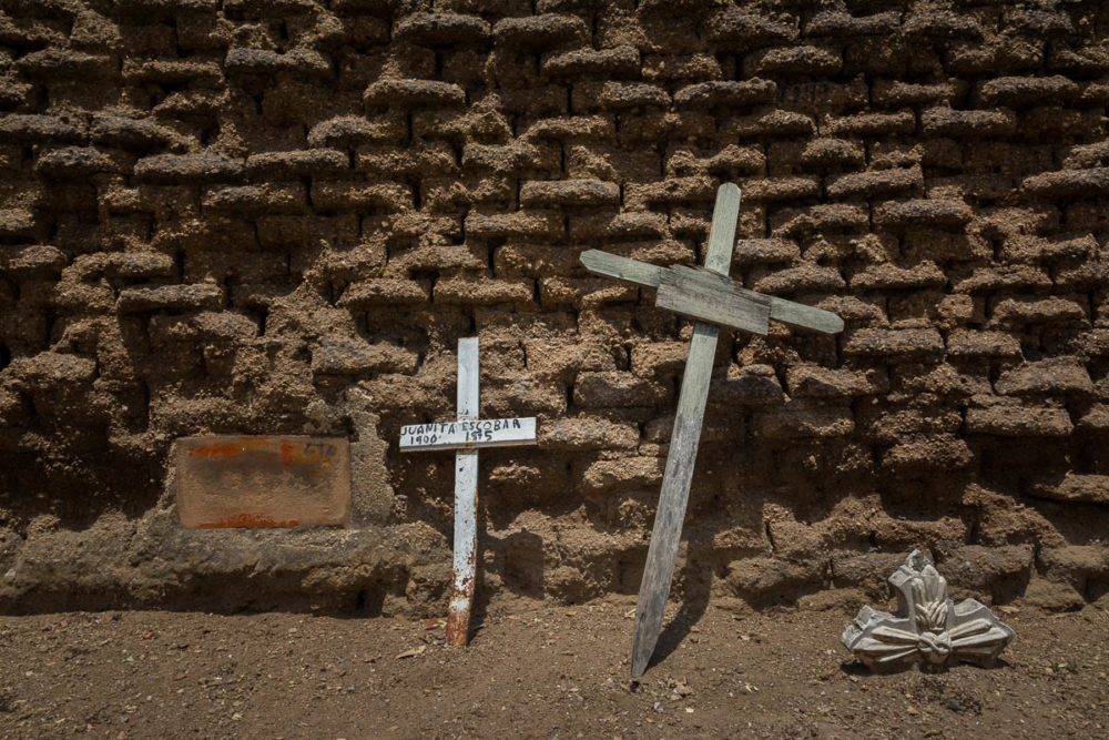 Crosses against an adobe wall in Tlaquepaque, Jalisco.