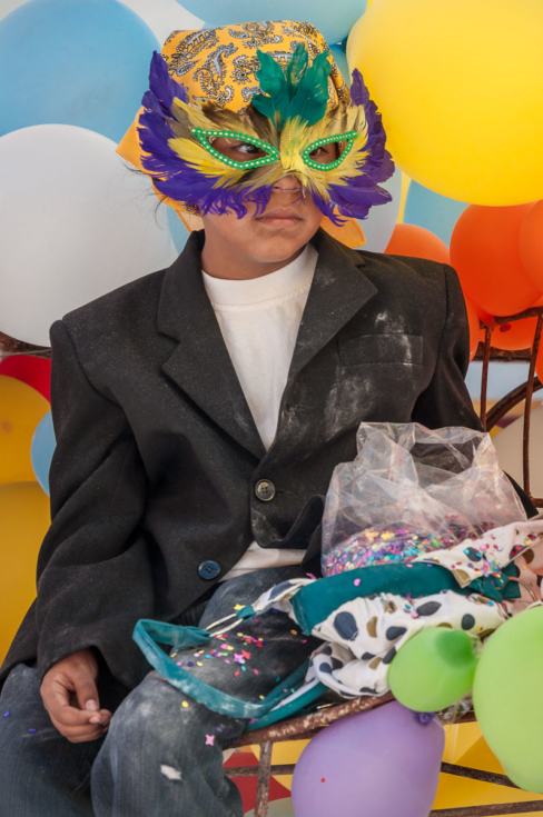 Boy with mask on float during Canaval parade in Ajijic.