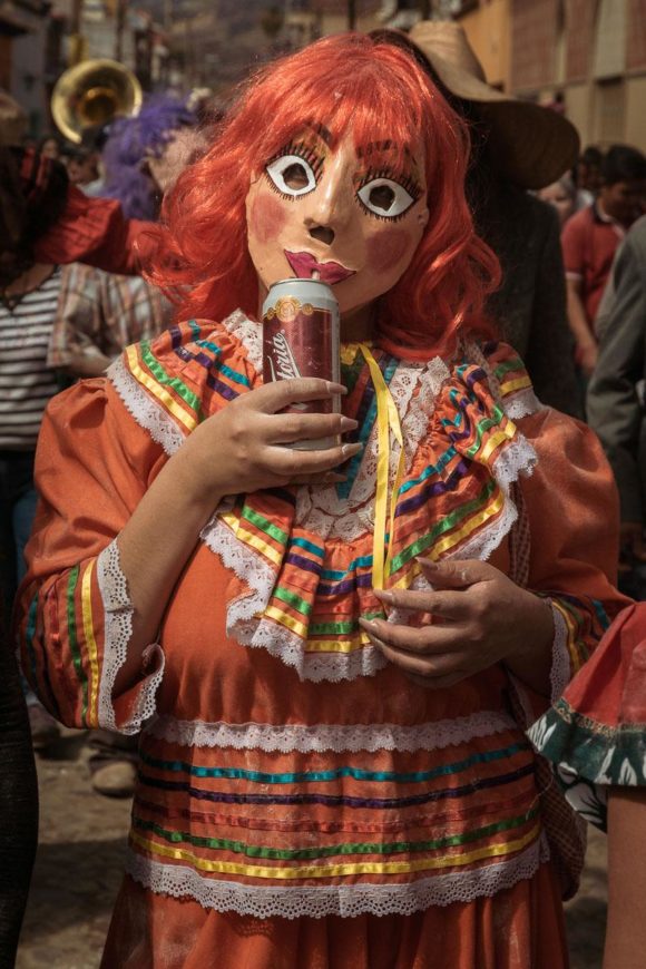 Fine art print of a sayaca drinking a Victoria during Carnival in Ajijic, Mexico