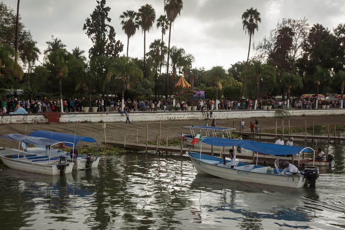 Over 300 people wait in line at the Chapala malecón for the chance to board one of the boats that normally take sightseers on tours around Lake Chapala.