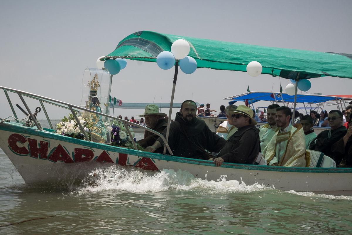 The Virgin of Zapopan returning from the Island of the Scorpions with other boats following closely behind.